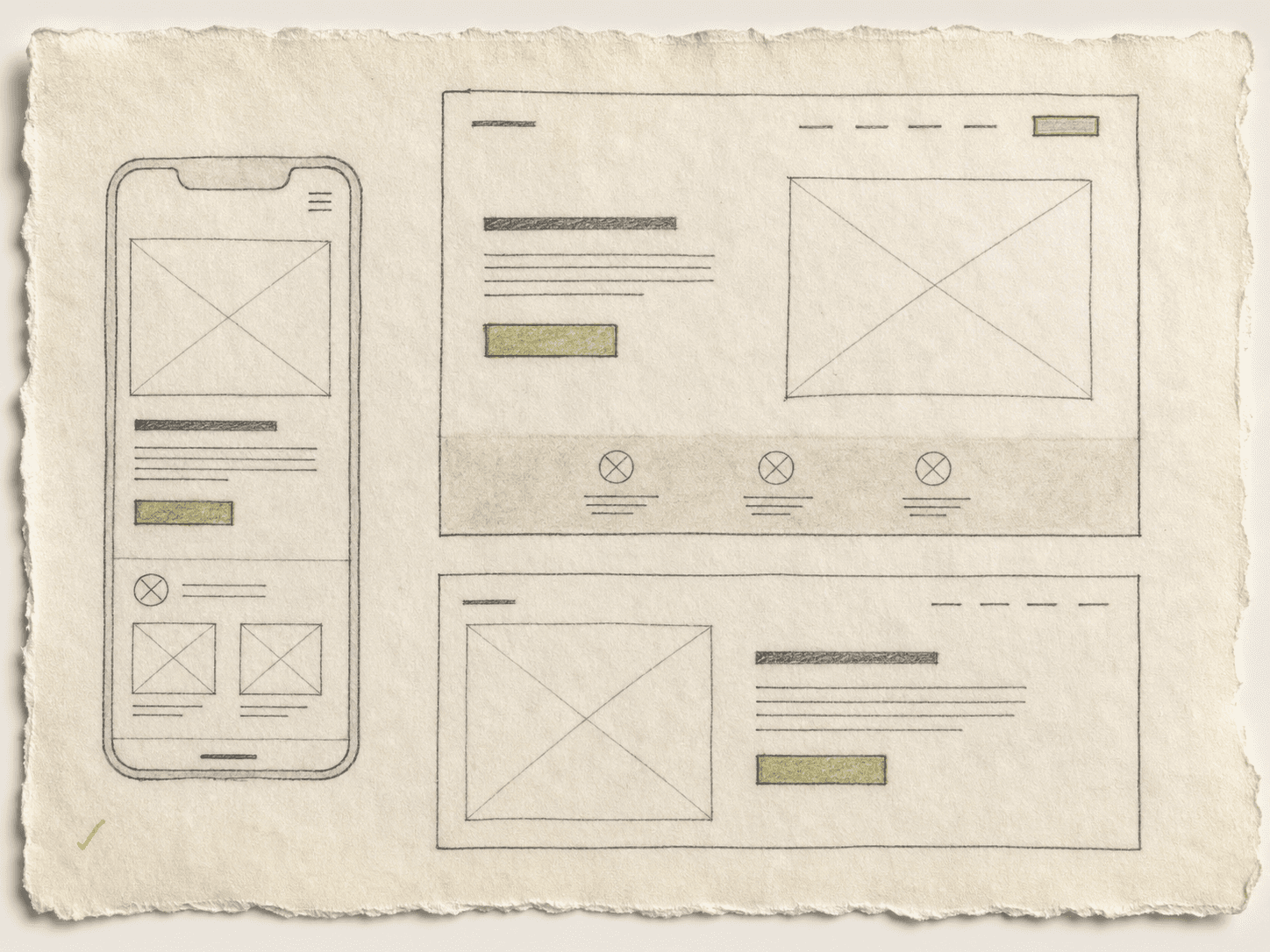 Responsive website wireframes drawn on paper